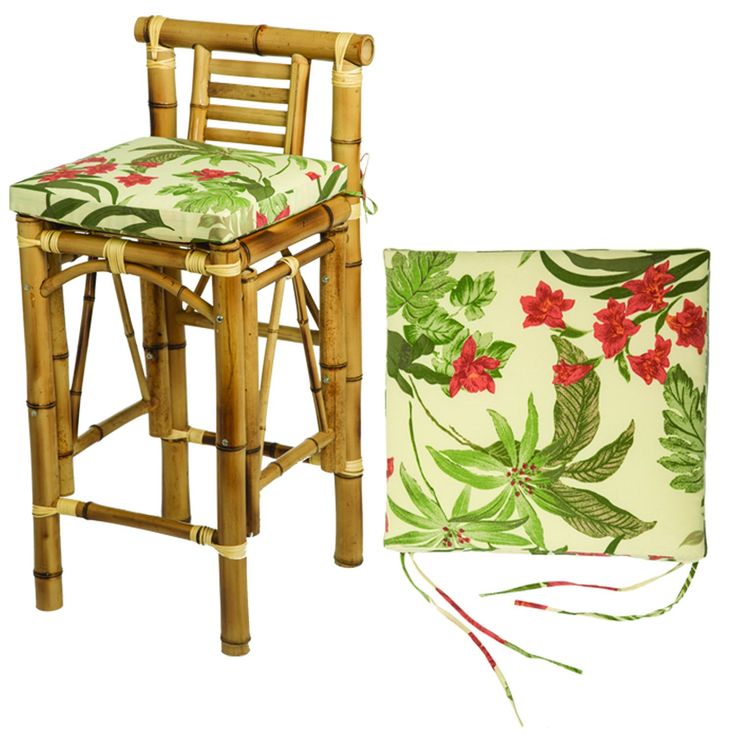 a chair with a cushion on it next to a bamboo stool and lamp shade cover