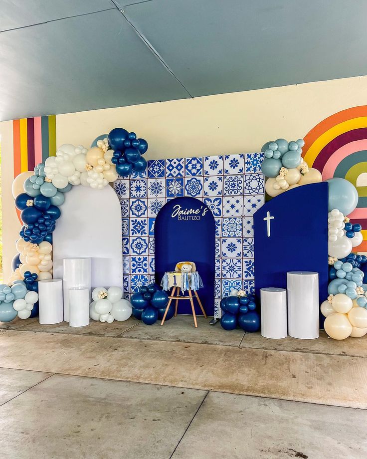 Bautizo: Talavera Edition 🔹 New Backdrop now Available! Check out this Joint Bautizo/1st Birthday setup! We love our new Talavera Backdrop & this color wave! #balloongarland #talavera #balloondecoration #bautizo #firstbirthday #eventplanner #eventstylist #balloonartist Clase Azul Party Decor, Baby Blue Baby Shower Ideas Boys, Welcome Stand, Rustic Theme Party, Mexican Graduation, Birthday Setup, Baptism Decorations Girl, Door Stand, Bautizo Ideas