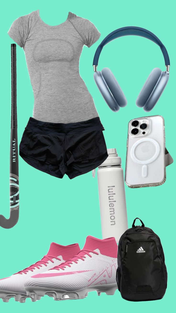 a woman's outfit with headphones, water bottle, cell phone and other items