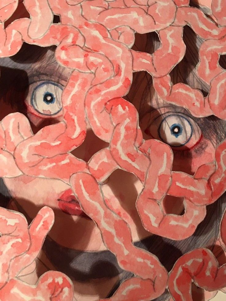 a person's face is surrounded by fake bacon links and blue - eyed eyes