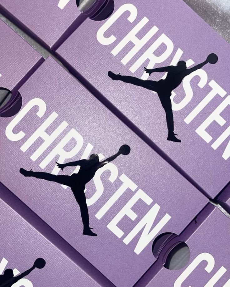 four purple boxes with black silhouettes of people holding tennis racquets