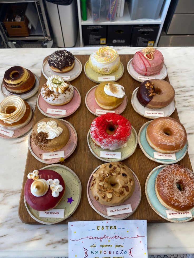 there are many different types of donuts on the table