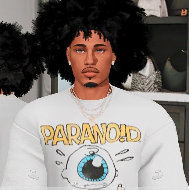 a man with black hair and blue eyes wearing a white shirt that says paranoid on it