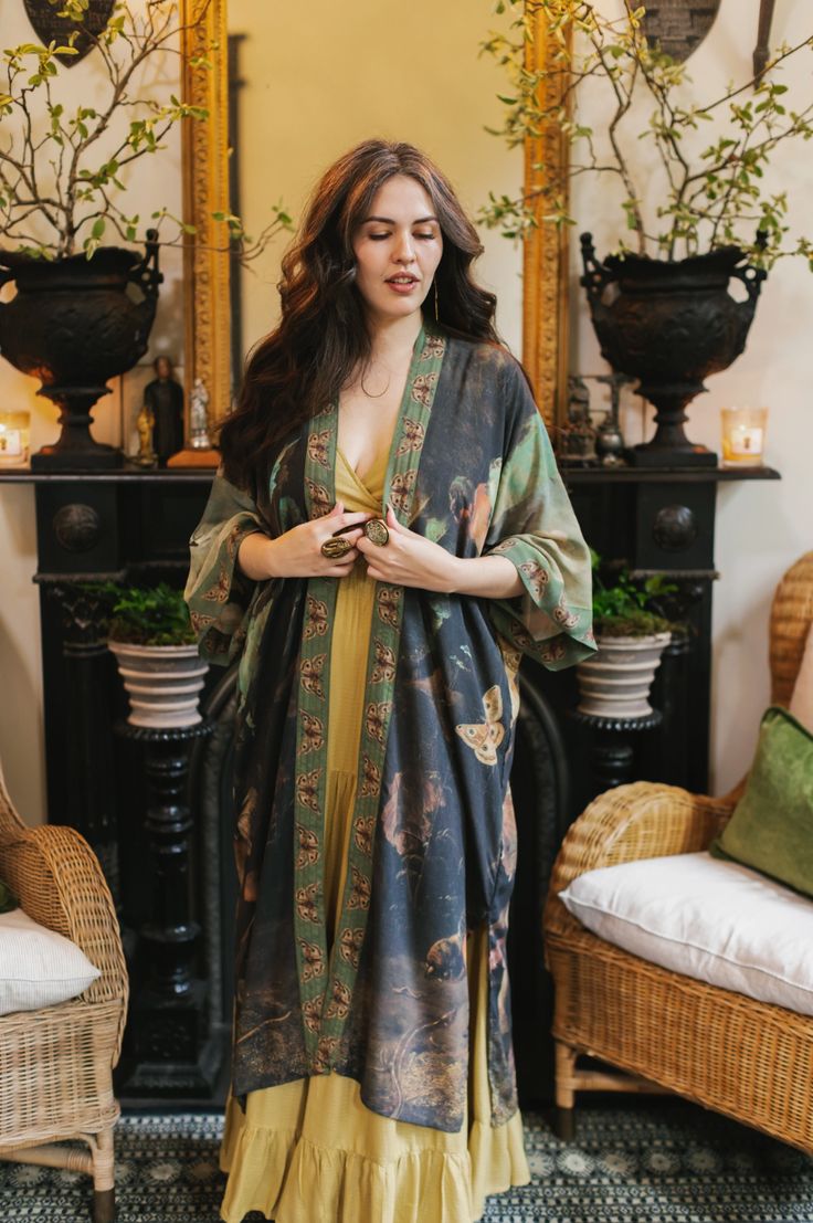 *CLOTHING / DOUBLE-LISTED (TITLE) DETAILS: 100% bamboo/wood viscose, wide sleeve, waist tie w loops, kimono style duster Machine wash gentle or handwash and hang to dry. Iron to finish if needed. Measurements: length 46.5" (118cm), width 30.5" (78 cm) (across back, underarm to underarm). Model is 5’7” for reference. DESIGN: This stunning piece features artist Artemisia Gentileschi’s self-portrait surrounded by lushly painted forest landscapes, birds, and butterflies. Gentileschi was an artistic Painted Forest, Women In Art, Moda Kimono, Artemisia Gentileschi, Duster Kimono, Birds And Butterflies, Mode Kimono, Bohemian Kimono, Witchy Fashion