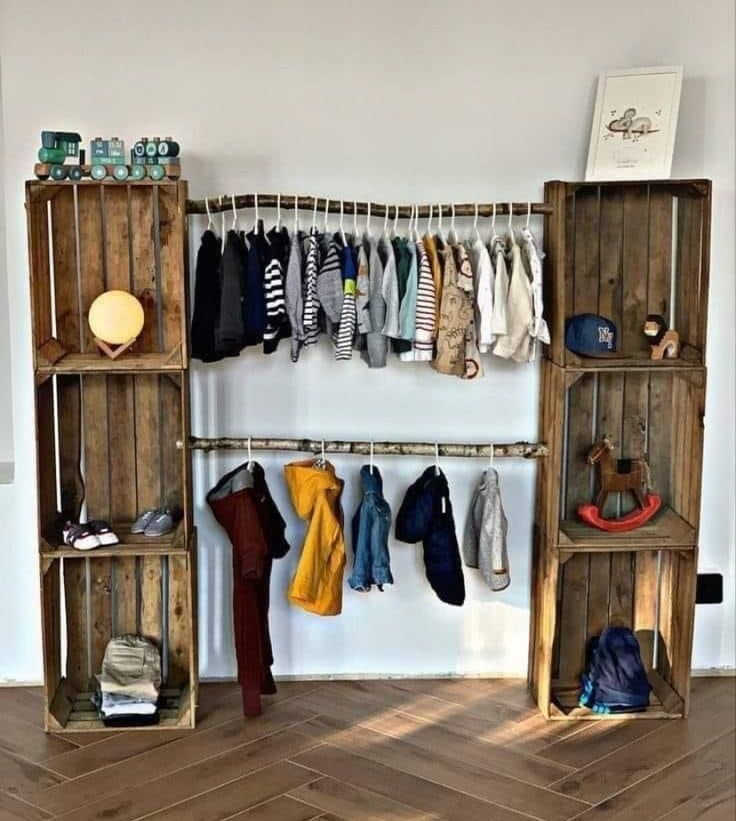 a wooden shelf filled with lots of clothes