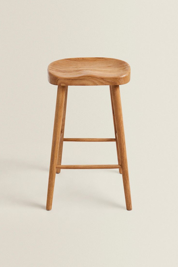 a wooden stool on a white background