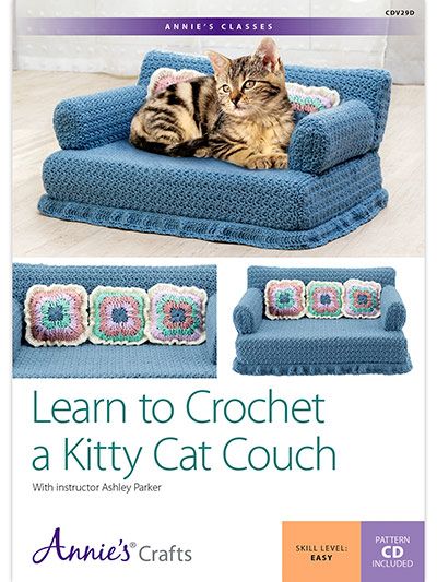 a cat laying on top of a blue couch next to a book cover with the title learn to crochet a kitty cat couch