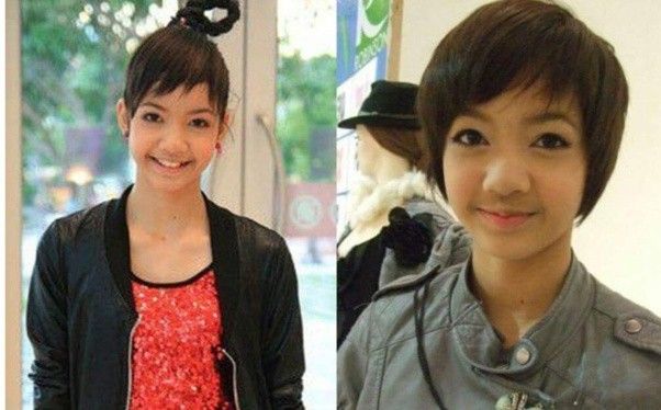 two young women are smiling for the camera and one is wearing a black jacket with a flower in her hair