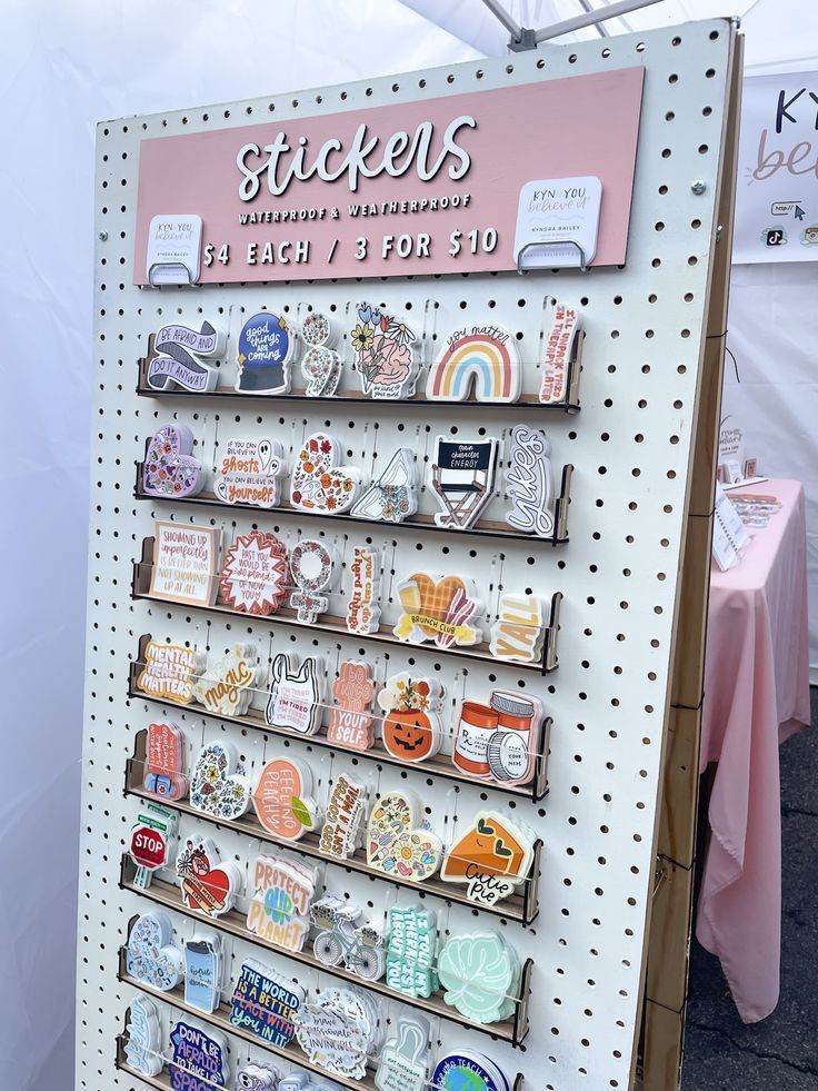 there is a sign that says stickers on the wall and it's for sale