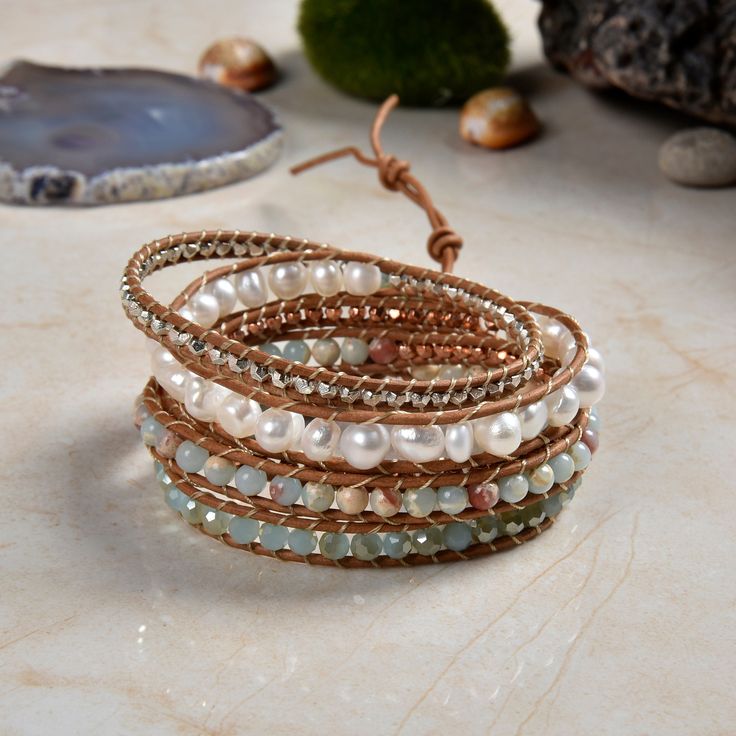 "Hand beaded and stitched on genuine leather. This unique wrap bracelet is designed to wrap around the wrist up to five times. Three adjustable closures measure approx. 33\", 34\", 35\" Exquisite workmanship! Material: Semi-baroque cultured freshwater pearls, blue jasper, and iridescent crystals. Clasp: SIlver tone toggle clasp. https://www.etsy.com/shop/MYGEMSROCK" Bohemian Beaded Leather Wrap Bracelet, Adjustable Hand Wrapped Leather Wrap Bracelet, Bohemian Hand Wrapped Leather Wrap Bracelet, Wrap Armband, Blue Jasper, Iridescent Crystal, Statement Bracelet, Freshwater Cultured Pearls, Rose Quartz Crystal