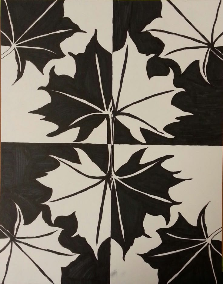 four black and white squares with leaves on them