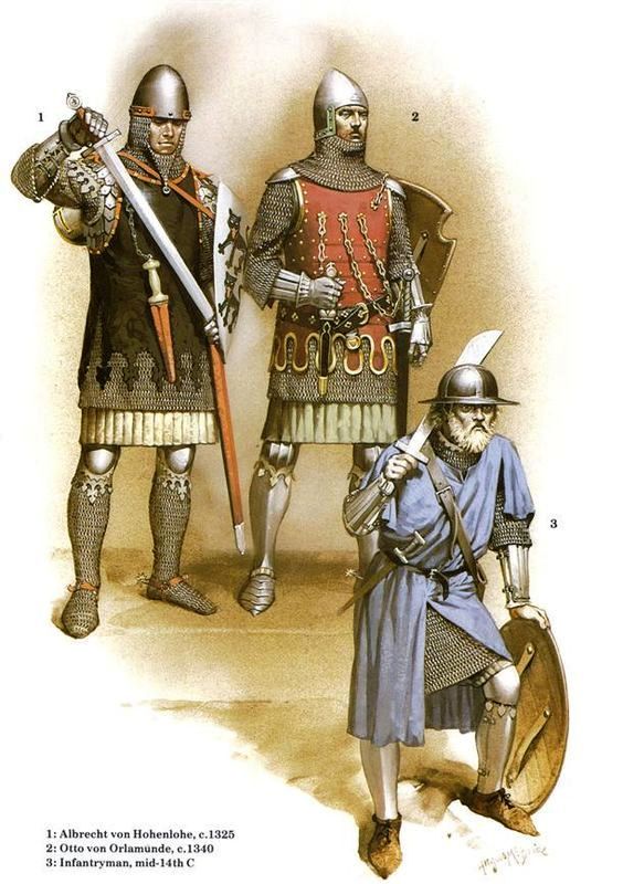 three men in armor standing next to each other