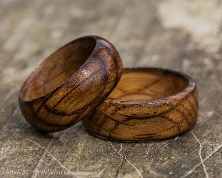 two wooden rings sitting on top of each other