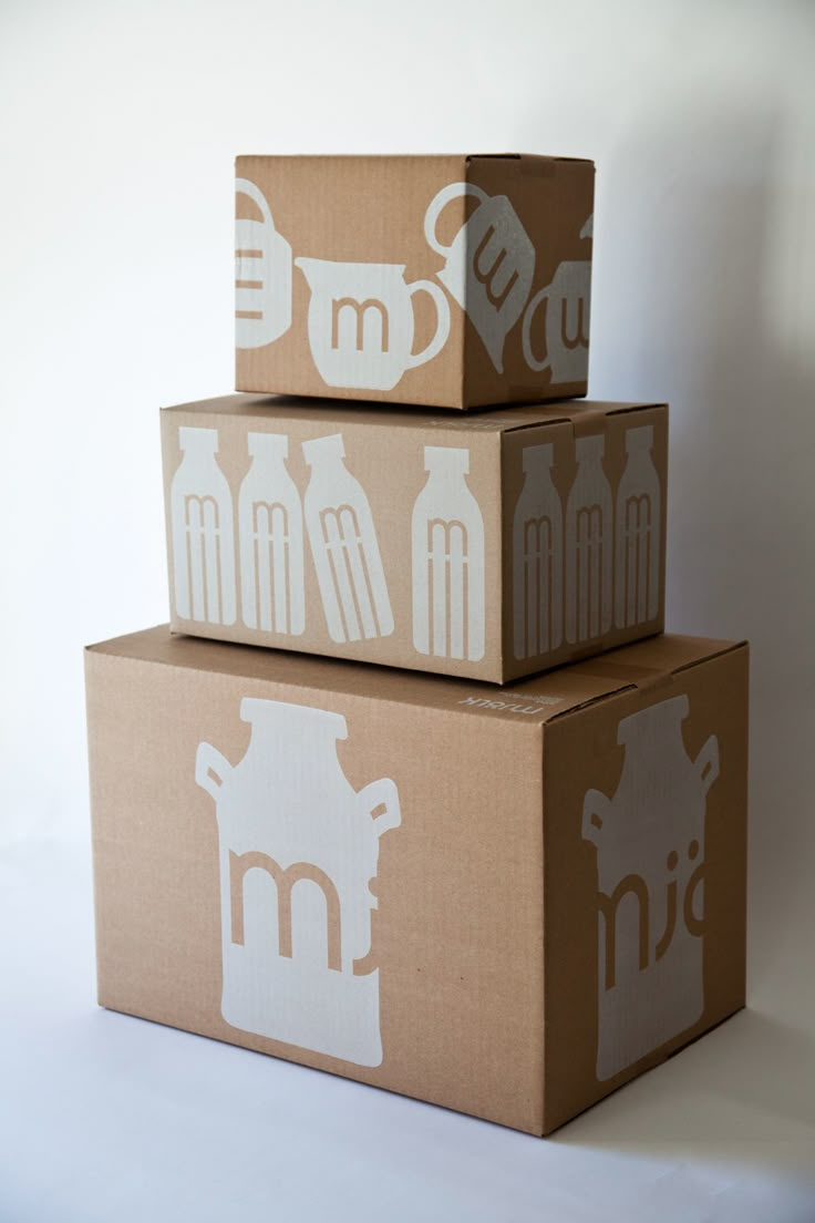 three boxes stacked on top of each other with the letters m and w painted on them