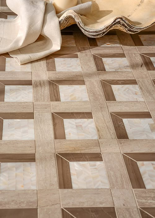 a close up of a tiled floor with a cloth on it