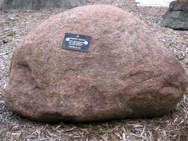 a large rock with a plaque on it