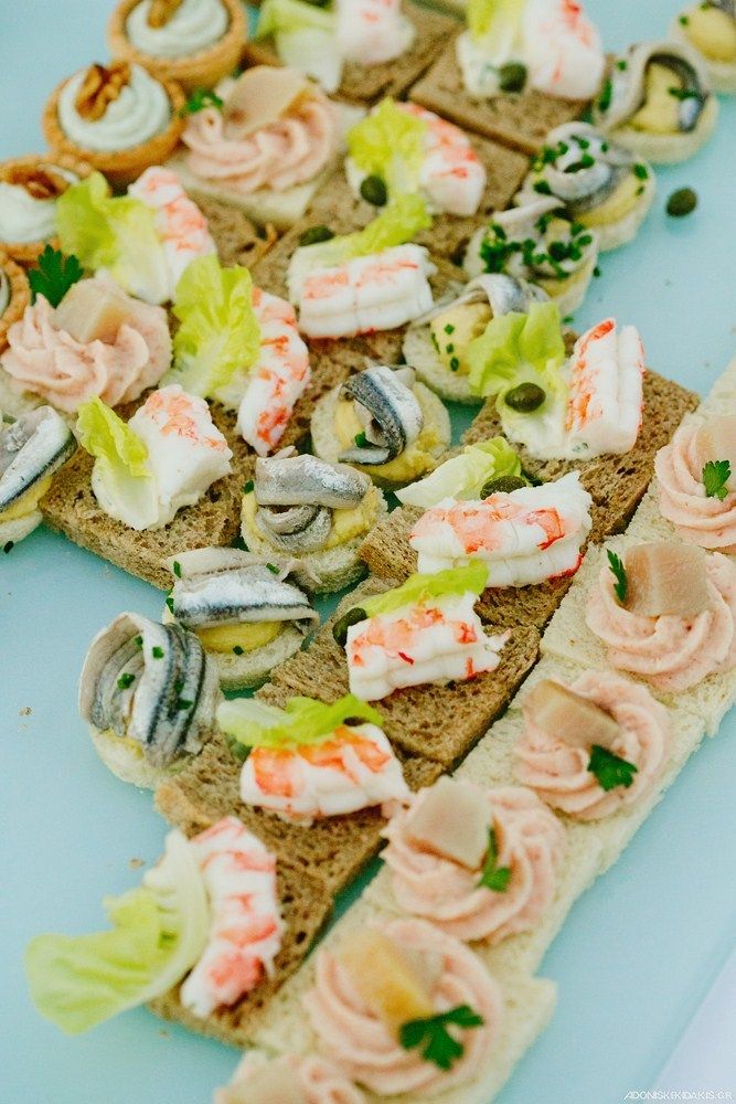 an assortment of appetizers are arranged on bread