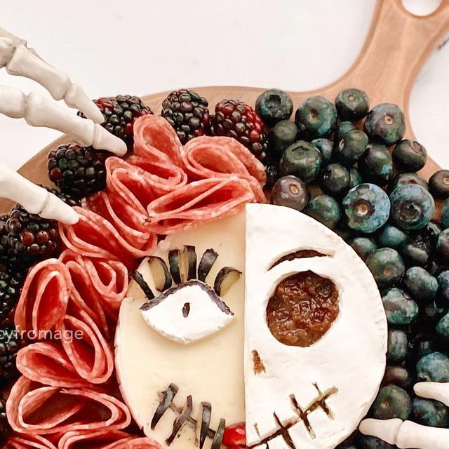 a wooden platter filled with different types of food