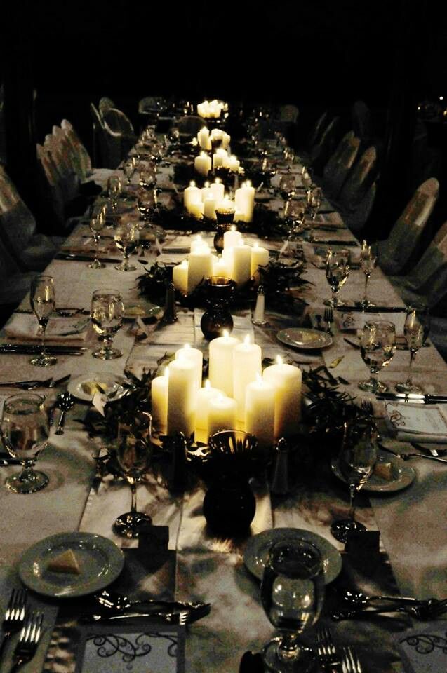 a long table with many candles on it