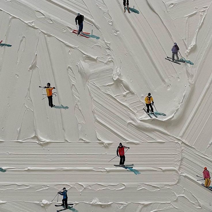 many people are skiing down a snowy hill