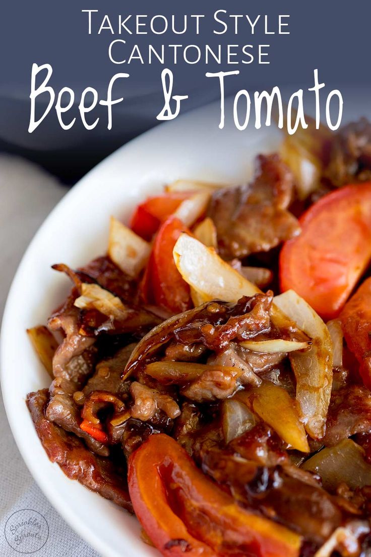 beef and tomato stir fry in a white bowl with text overlay that reads takeout style cannoise beef and tomato