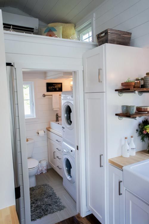 a washer and dryer in a small room