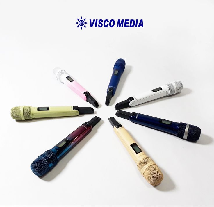 six different pens arranged in a circle on a white surface with the visco media logo behind them