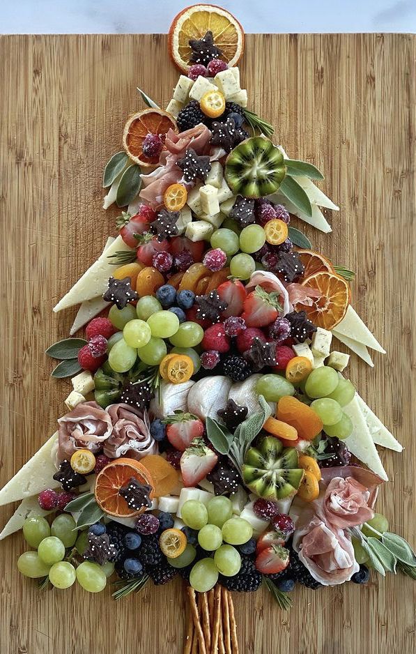 a christmas tree made out of fruits and vegetables