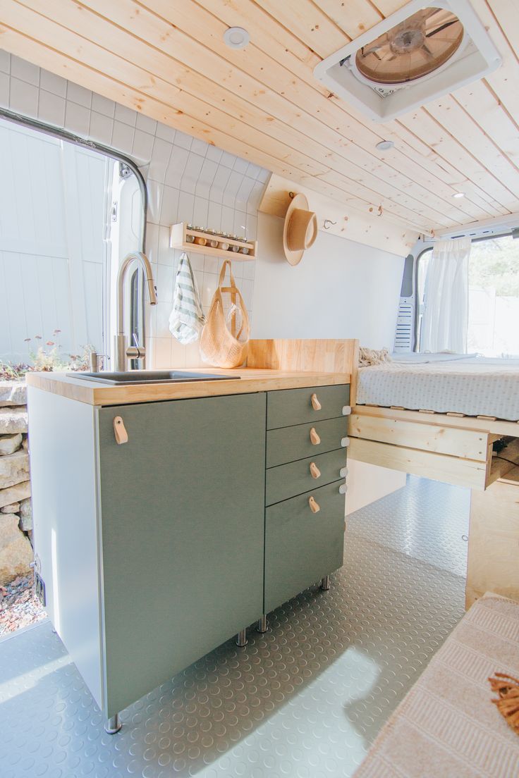 the kitchen is clean and ready to be used as a camper or home office