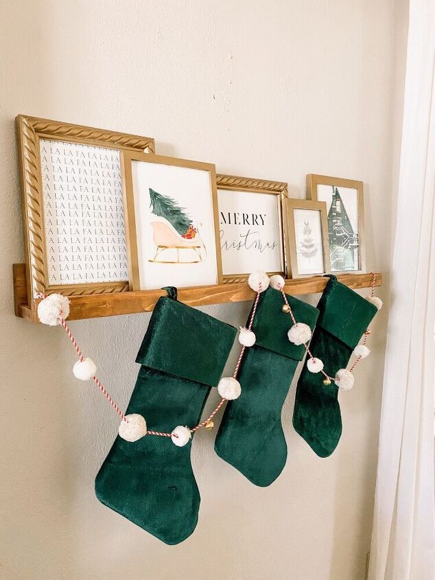 christmas stockings hung on the wall with pictures