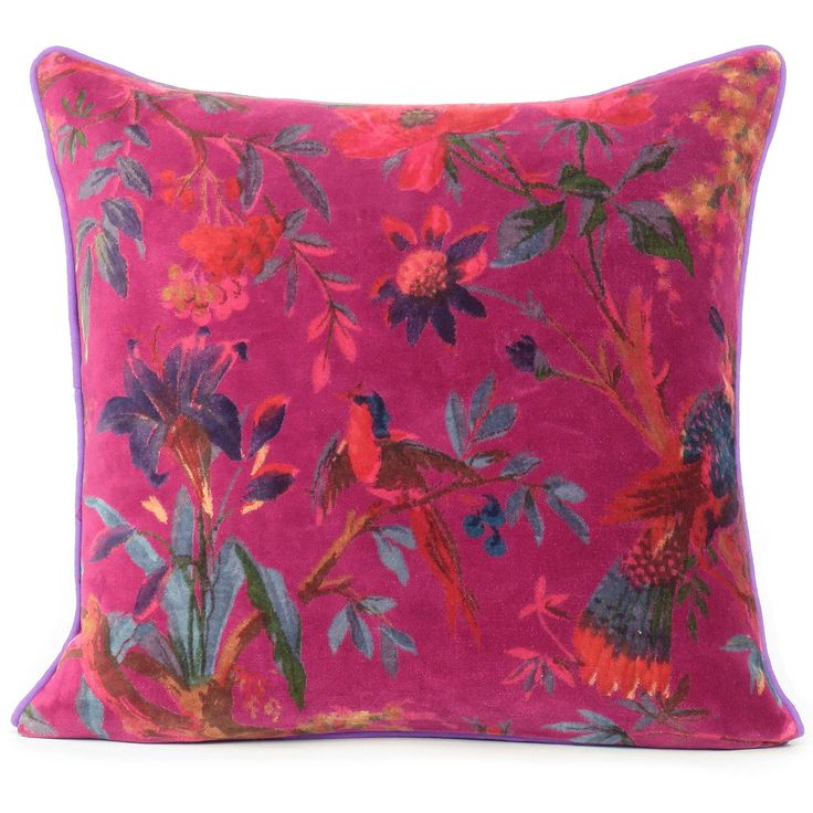 a pink pillow with colorful flowers on it