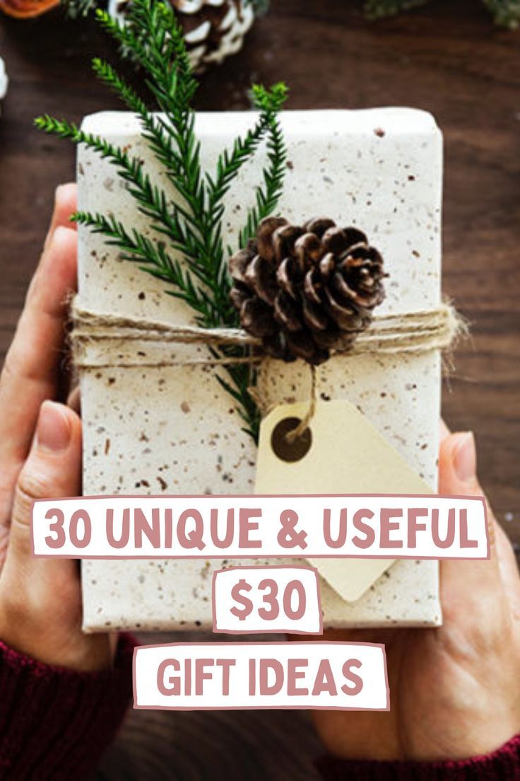 a person holding a present wrapped in white paper with pine cones on top and the words 30 unique & useful $ 30 gift ideas