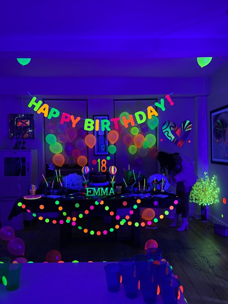 a birthday party with neon lights and decorations