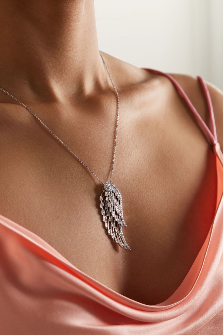 Garrard's necklace is designed to mimic the natural shape and delicacy of angel wings - each pendant is intricately crafted to move independently from another as they overlap. Cast from 18-karat white gold in an openwork design that brings "an ethereal lightness", they're illuminated with round-cut diamonds to accentuate their swooping curves and strung on an adjustable chain. Luxury Flower-shaped Diamond Necklace In Fine Jewelry Style, Elegant Wing-shaped Jewelry As Gift, Elegant Wing-shaped Jewelry Gift, Elegant Silver Wing-shaped Necklace, Elegant Wing-shaped White Gold Necklace, Elegant White Gold Wing-shaped Necklace, Elegant Sterling Silver Winged Necklace, Elegant Silver Wing-shaped Jewelry, Elegant Wing-shaped Silver Jewelry