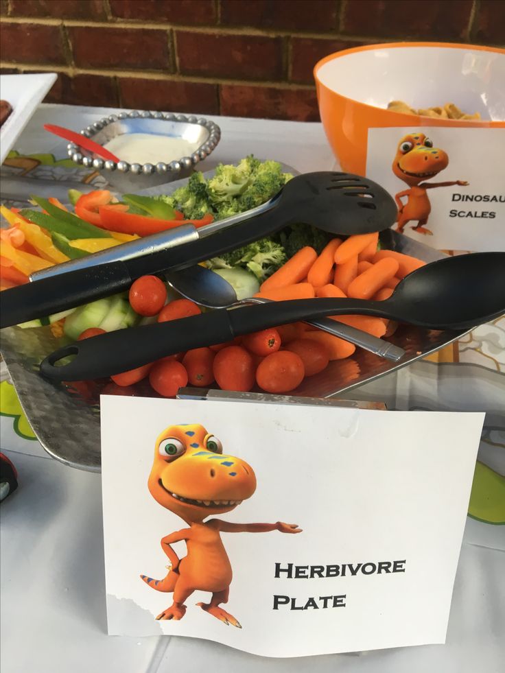 a table topped with carrots, broccoli and other vegetables