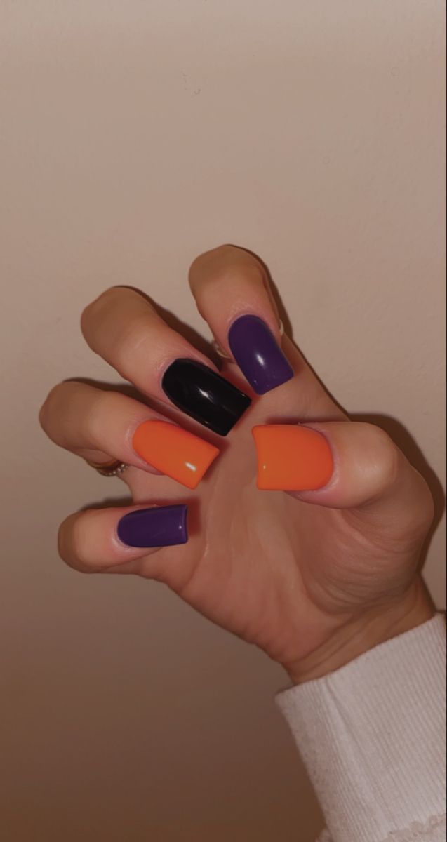 purple black orange nails halloween Black Orange Purple Halloween Nails, Halloween Nails Plain, Halloween Color Nails Acrylic, Purple Orange Nails Halloween, Purple Orange And Black Nails, Purple Black Orange Nails, Orange Purple Halloween Nails, Black Purple And Orange Nails, Black Orange And Purple Nails