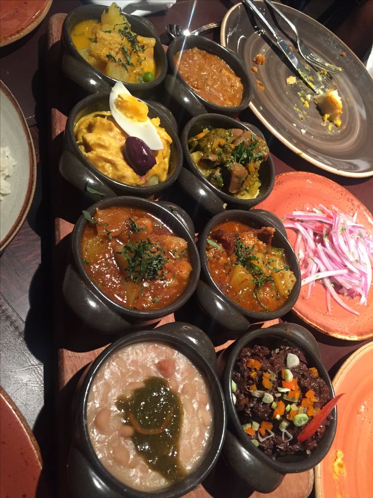 a table topped with bowls filled with different types of food