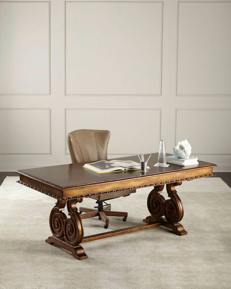 a wooden table sitting on top of a white rug