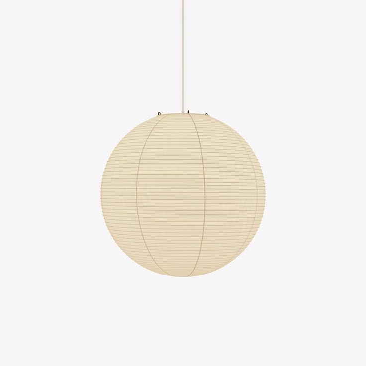 a round light fixture hanging from a ceiling