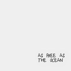 a black and white photo with the words as free as the ocean written below it