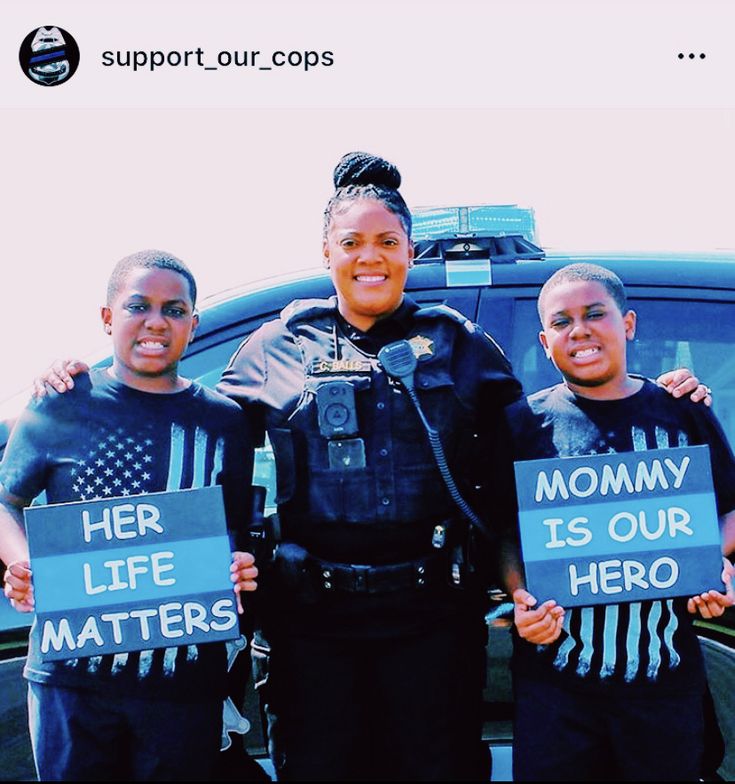 three police officers holding up signs with the words her life matters hero written on them