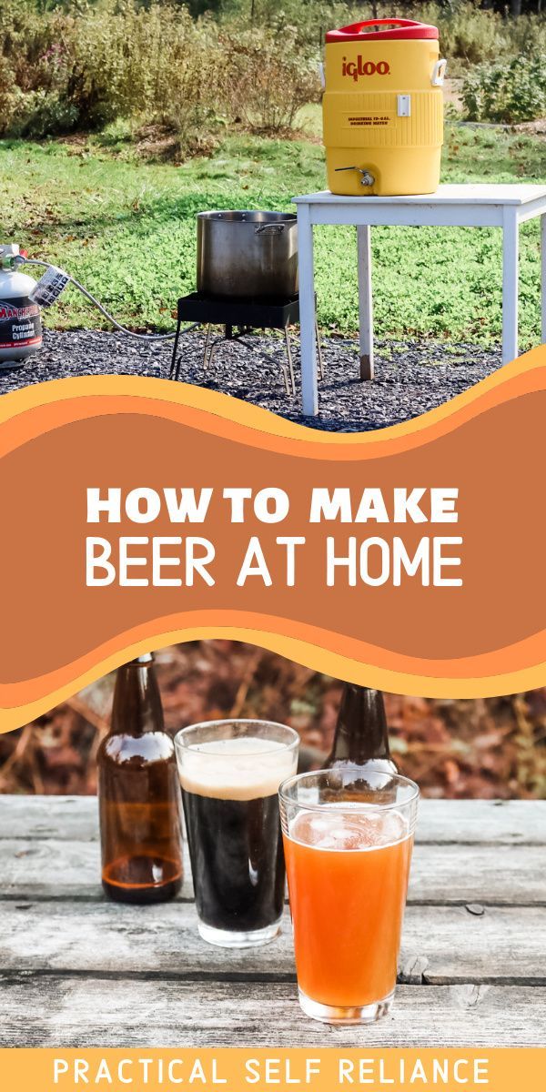 two glasses of beer sitting on top of a wooden table next to an open cooler