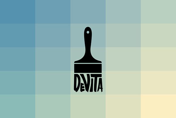 a black paint brush with the word devita on it