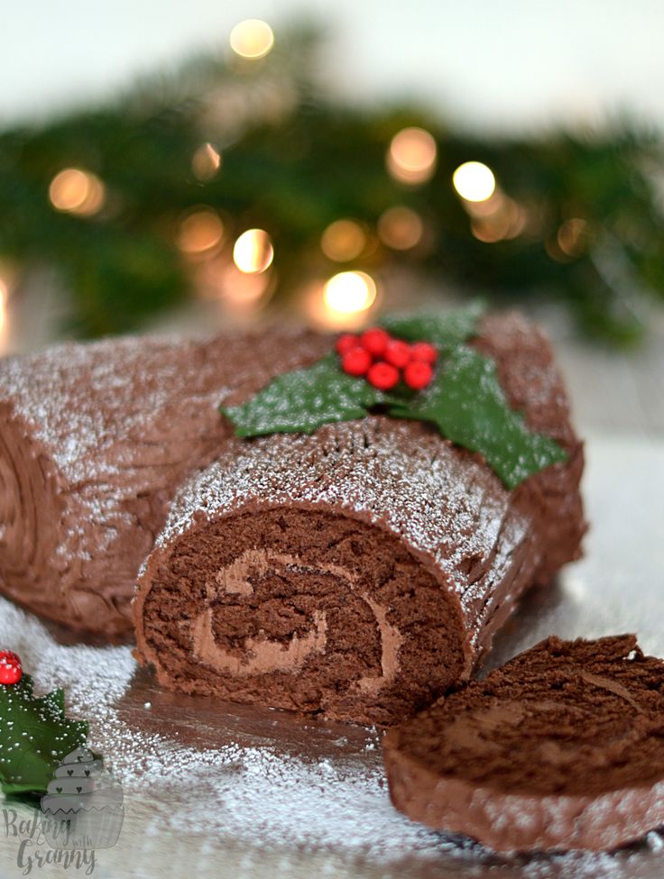 a chocolate christmas roll is cut into pieces