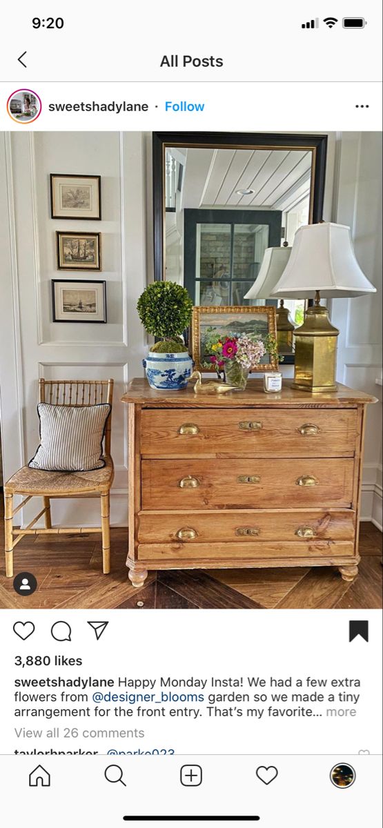 a wooden dresser sitting on top of a hard wood floor