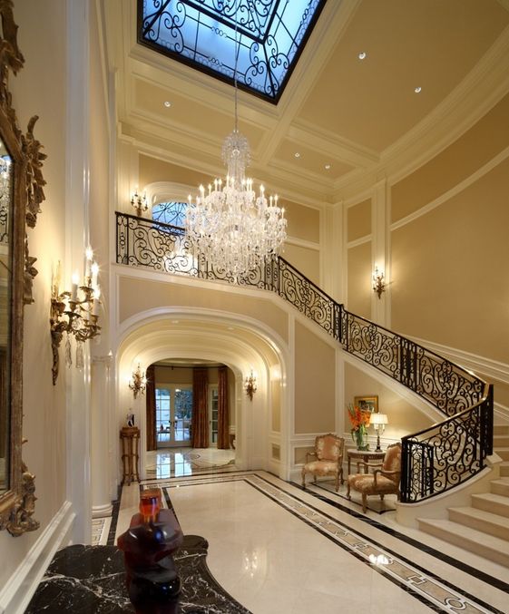 an open floor plan with stairs and chandelier in the center is featured on instagram