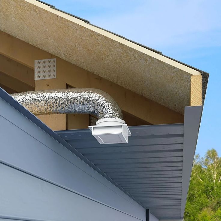 a gutter hose attached to the side of a house