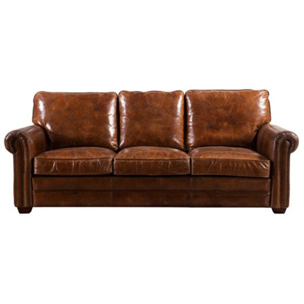 a brown leather couch on a white background