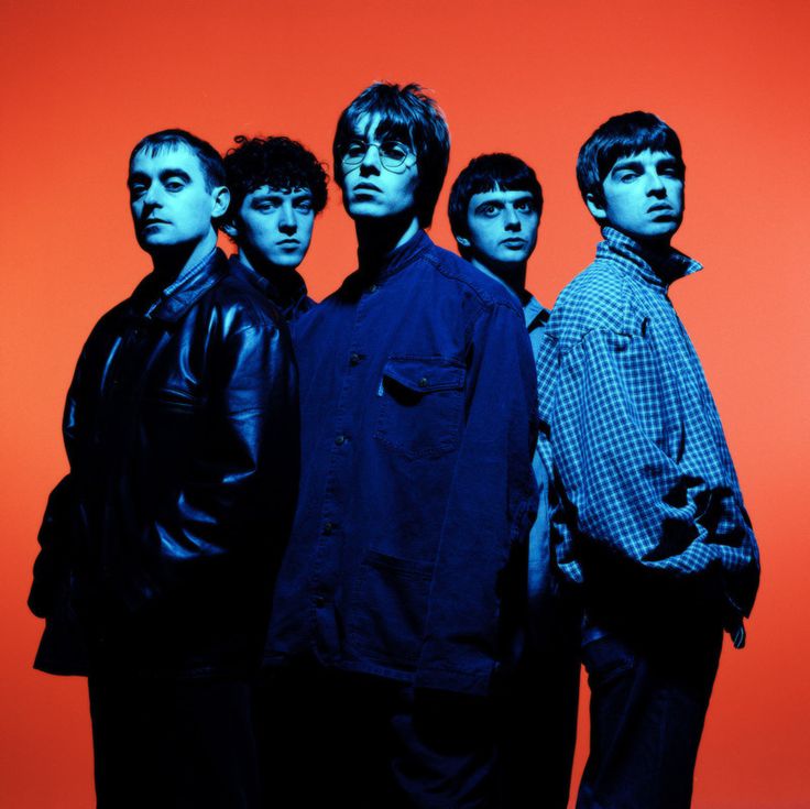 five young men standing in front of an orange background