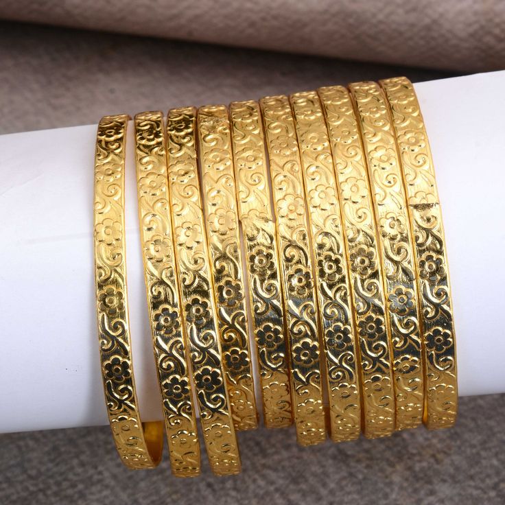 14kt Gold Plated 10 Pcs Look Slim Sleek Indian Bridal Bangle Bracelet Set ❥ Customers satisfaction is our biggest priority, please contact us with any questions/queries for future or existing orders, and we will do our best to make sure you are happy with your order. ❥Please make sure to add the correct address during check out. You can return your purchased item within 15 days after successful delivery. We offer a 100% "Money Back Guarantee" if you are not satisfied with your purchase. Return charges will be paid by buyers only! ❥ Please share your numbers (in personalization box ) as required for shipping address details, and it'll help us to contact you easily. And don't worry about the privacy, we'll keep it safe with us, So try to cooperate with us. :) You can visit my shop for more e Gold Metal Bangle For Anniversary, Simple Gold Bangle, Indian Bracelets, Hammered Bangles, Gold Jewellry, Stackable Bangles, Women Jewellery, Bangles Design, Gold Armband